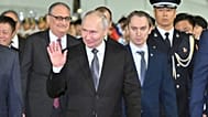 In this photo released by Xinhua News Agency, Russian President Vladimir Putin arrives for a state visit in Beijing on Tuesday, May 19, 2026