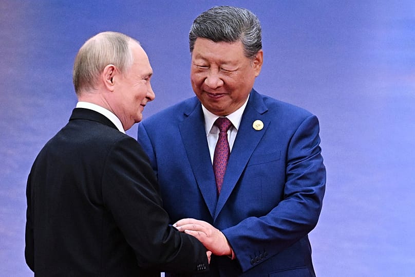 FILE - Russian President Vladimir Putin, left, and Chinese President Xi Jinping greet each other in Tianjin, China, on Aug. 31, 2025