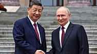 Russian President Vladimir Putin and Chinese President Xi Jinping shake hands during a welcome ceremony at the Great Hall of the People, in Beijing, China, May 20, 2026. 