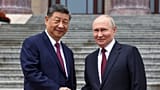 Russian President Vladimir Putin and Chinese President Xi Jinping shake hands in Beijing, China, Wednesday, May 20, 2026.