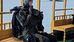 n this handout photo release by Maldives President Media Division, a Finnish diver gets ready to attempt to recover the bodies of two of the four Italians who died deep inside