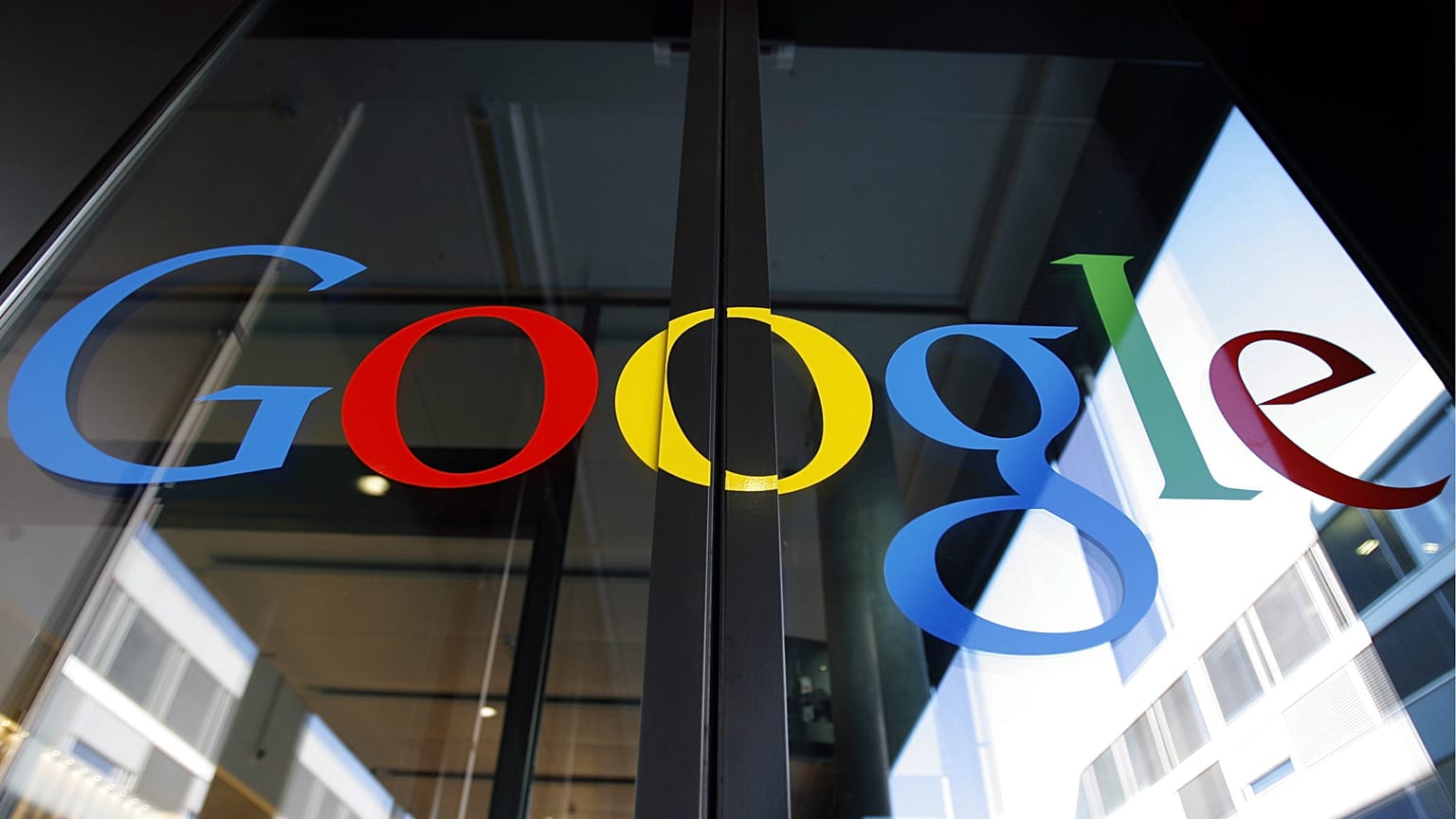 FILE - This Thursday, March 6, 2008 file photo shows the logo of Google on the front door of the new Google European tech center in Zurich, Switzerland