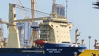 FILE - The South Korean-operated vessel HMM NAMU docked after being damaged from a fire in the Strait of Hormuz, at a port in Dubai, United Arab Emirates. May 8, 2026