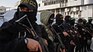 مسلحون فلسطينيون من حماس والجهاد الإسلامي يتجمعون بجوار صلاة عيد الفطر في مدينة غزة، الجمعة 20 مارس 2026. (صورة AP/عبد الكريم هناء)