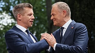 Poland's Prime Minister Donald Tusk, right, and Hungarian Prime Minister Peter Magyar shake hands after a joint press conference in Warsaw, Poland, Wednesday, May 20, 2026. 