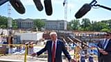 President Donald Trump tours Ballroom construction around the outside the White House, Tuesday, May 19, 2026, in Washington.