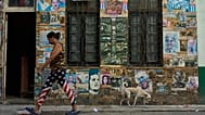 A woman walks along a street in Havana, 19 May, 2026