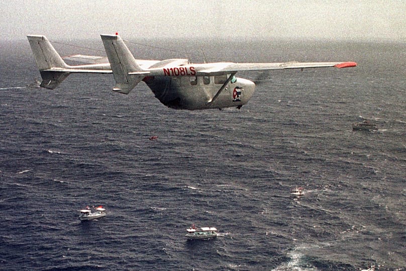 A Brothers to the Rescue plane flies over The Democracy Movement flotilla at the twelve-mile limit north of Havana, 10 July, 1999