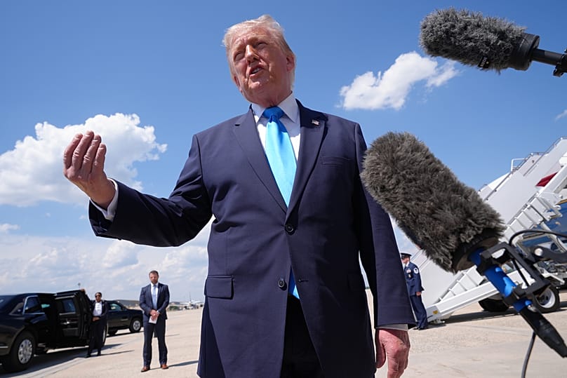 US President Donald Trump speaks to the press after returning and stepping off Air Force One at Joint Base Andrews, 20 May, 2026