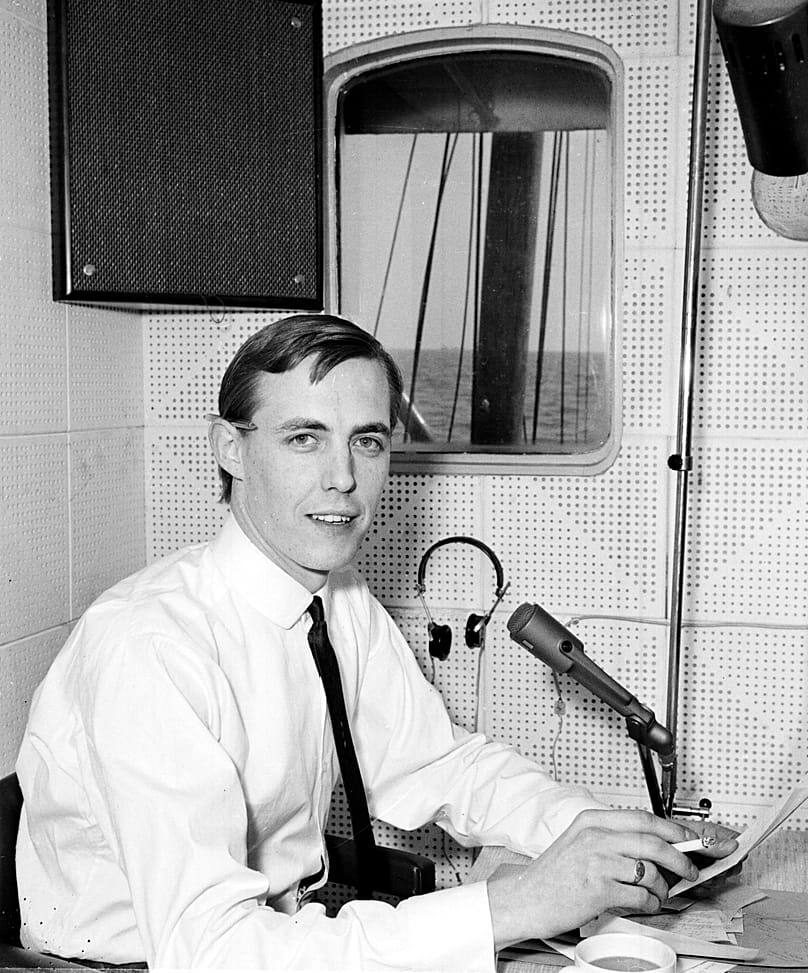 Canadian-born disc jockey Simon Dee broadcasts on Radio Caroline onboard a ship moored in international waters off the English East coast, 14 April, 1964