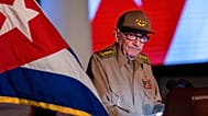 FILE - Former Cuban President Raul Castro looks at the Cuban flag during his speech at an event celebrating the 65th anniversary of the revolution, Cuba, Jan. 1, 2024