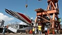 Workers unloading debris belonging to Air France flight AF447 from the Brazilian Navy's Constitution Frigate in the port of Recife, 14 June, 2009 