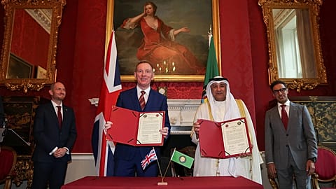 Britain Minister of State for Trade Chris Bryant and Jasem Mohamed Albudaiwi from the Gulf Cooperation Council take part in a signing ceremony in London. May 20, 2026. 