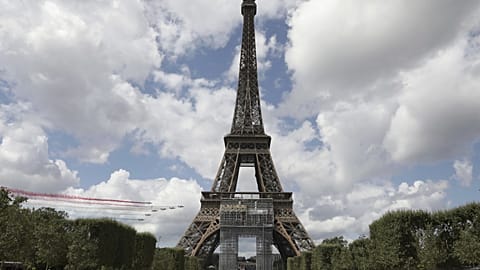 The French Air Force display team flies over the Eiffel Tower in Paris on Sunday 8 August 2021.