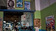 Posters of Cuban Revolutionary figures at the entrance of a repair shop in Havana, 19 May, 2026