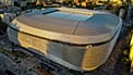 Toma aérea del Estadio Santiago Bernabéu en Madrid durante el atardecer mostrando su arquitectura moderna