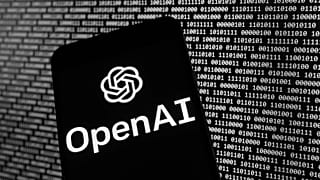 FILE - The OpenAI logo appears on a mobile phone in front of a computer screen with random binary data, March 9, 2023, in Boston. 