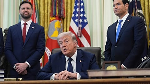 US President Donald Trump speaks as Secretary of State Marco Rubio, right, and Vice President JD Vance listen, April 23, 2026. (AP Photo/Mark Schiefelbein)
