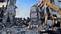 Russian rescuers clearing debris of destroyed college dormitory in Luhansk