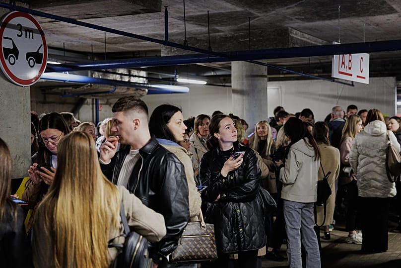 People take shelter in an underground car park during an air raid alert in Vilnius, Lithuania, Wednesday, 20 May, 2026.