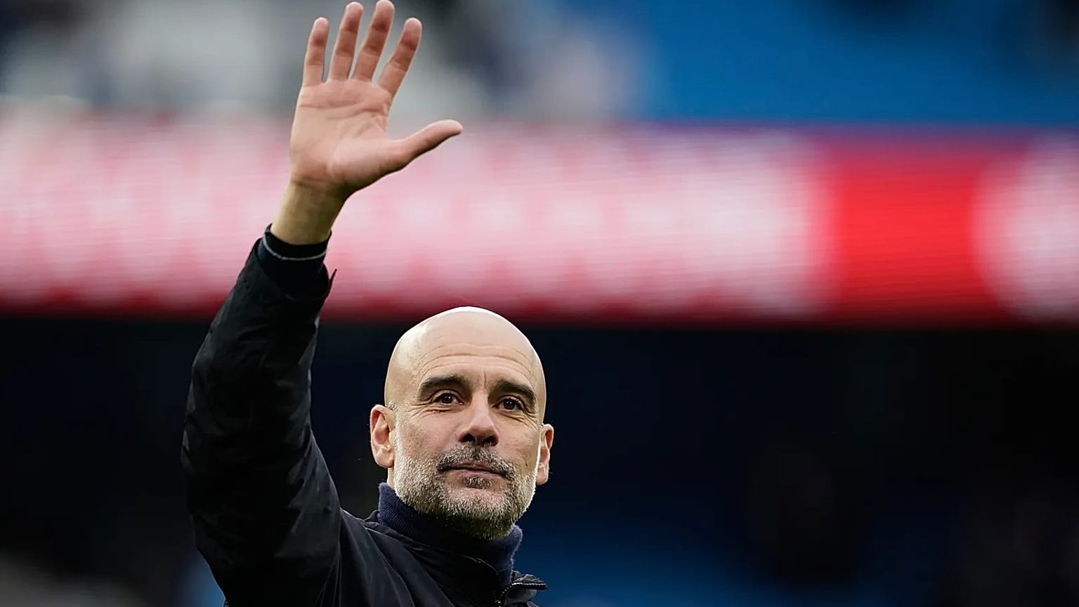 Manchester City's head coach Pep Guardiola greets fans in Manchester, 9 May, 2026