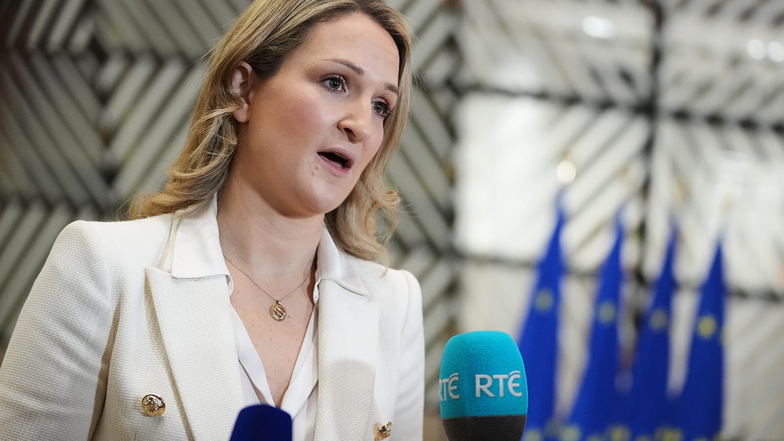 Ireland's Foreign Minister Helen McEntee speaks with the media as she arrives for a meeting of EU foreign ministers Dec. 15, 2025.