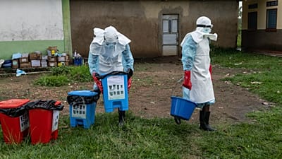 Medical staff prepare to disinfect the Ebola treatment center following a fire at the facility in Rwampara, Congo, Thursday, May 21, 2026.