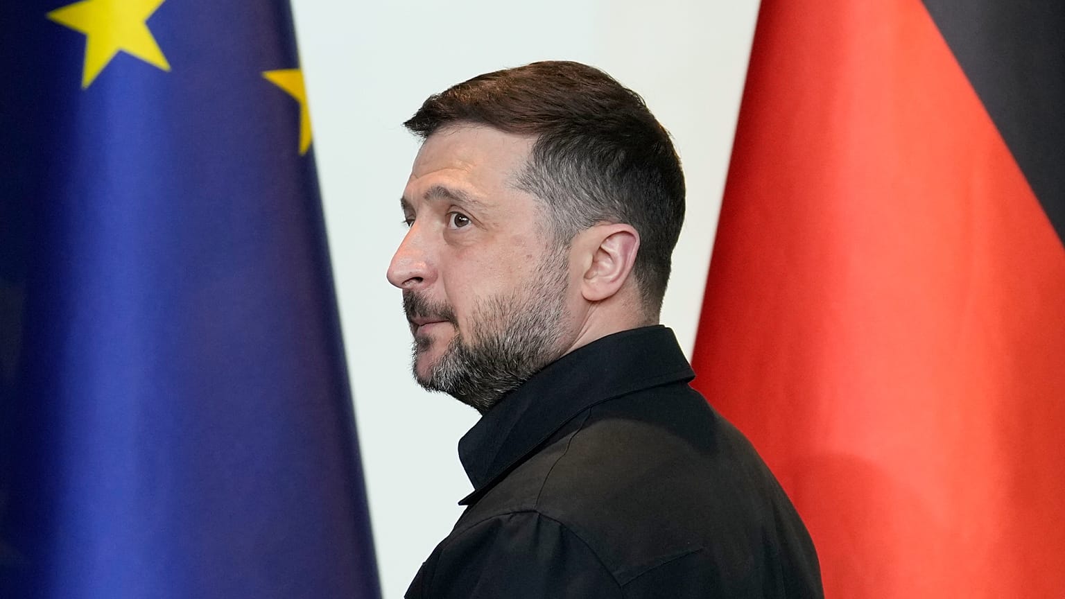 Ukraine's President Volodymyr Zelenskyy leaves a press conference at the German-Ukrainian government consultations in Berlin Germany, Tuesday, April 14, 2026.