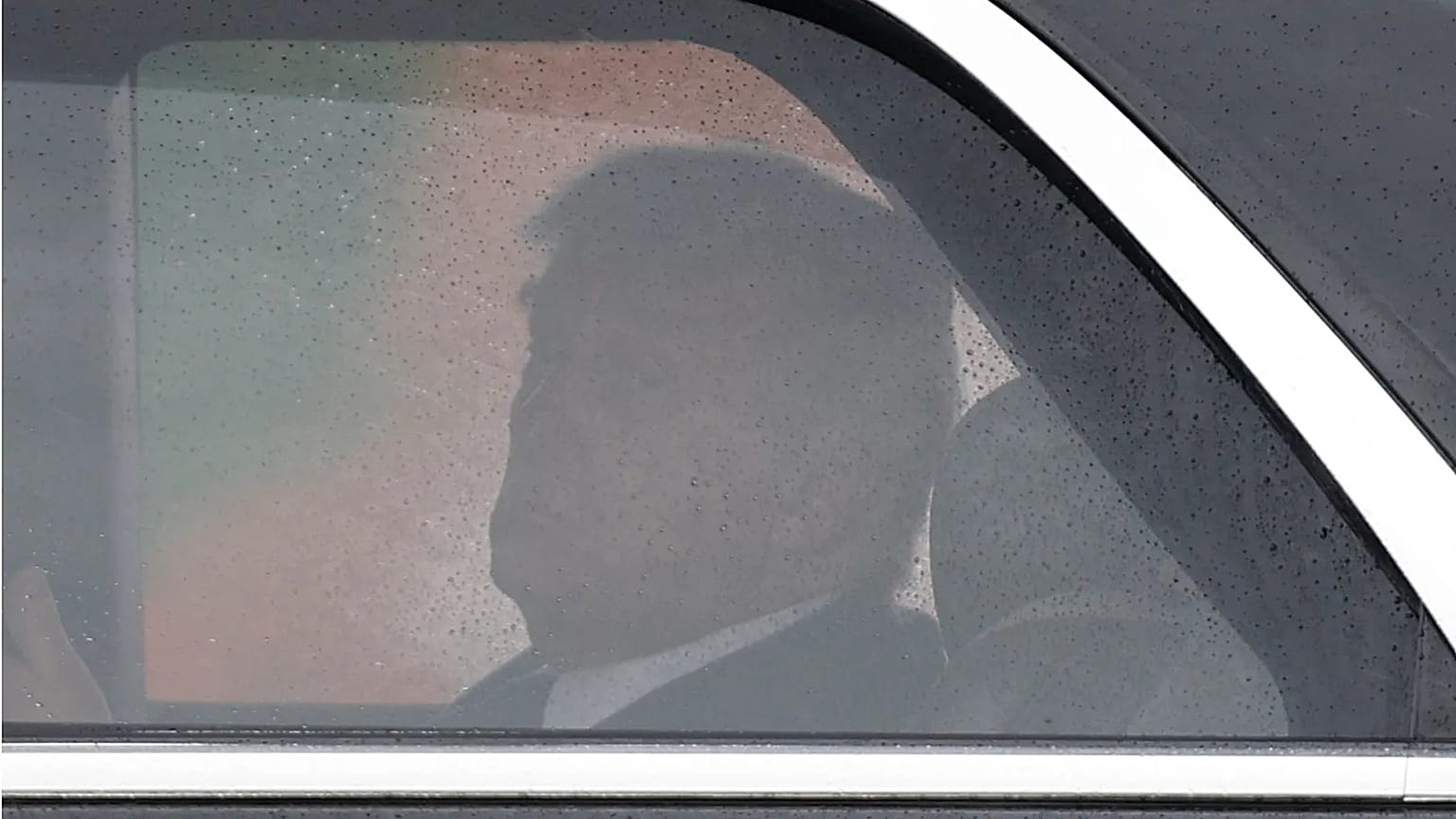 President Donald Trump looks toward Air Force One from his limousine known as "The Beast," upon his arrival at Joint Base Andrews, Md., Friday, May 22, 2026.