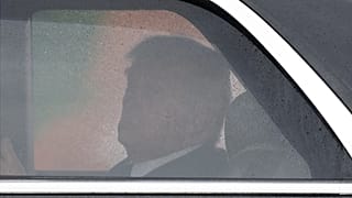 President Donald Trump looks toward Air Force One from his limousine known as "The Beast," upon his arrival at Joint Base Andrews, Md., Friday, May 22, 2026.