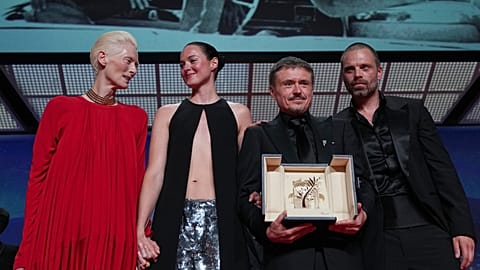 Tilda Swinton, left, poses with Renate Reinsve, Cristian Mungiu, winner of the Palme d'Or for 'Fjord' and Sebastian Stan during the awards ceremony.
