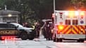 US Secret Service Police and DC Emergency Medical Services are seen on a crime scene after responding to reports of shots fired near the White House, May 23, 2026.