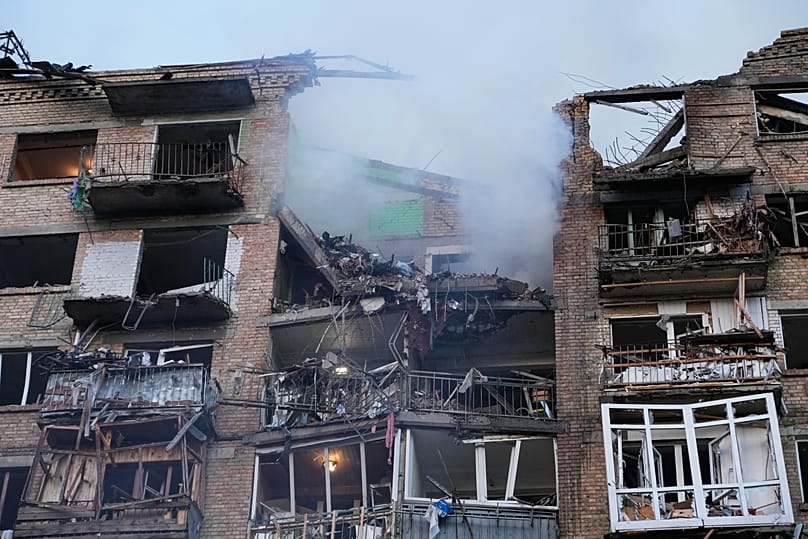 The interiors of apartments in a damaged residential building are exposed following a Russian missile attack in Kyiv, Ukraine, Sunday, May 24, 2026. 