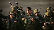 صورة أرشيفية.-يستمع جنود إسرائيليون إلى قائدهم أثناء استعدادهم لمسيرة قرب عين ياهف في جنوب إسرائيل، 20 ديسمبر/كانون الأول 2006. 