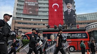 Police officers arrive at Turkey's main opposition Republican People's Party (CHP) headquarters in Ankara, Sunday, May 24, 2026, to evict supporters gathered inside. 