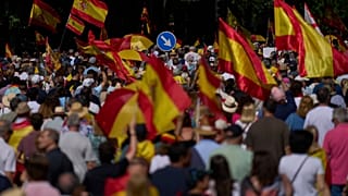 Demonstrators holding Spanish flags take part in a protest against Prime Minister Pedro Sanchez's government in Madrid, Spain, Saturday, May 23, 2026.
