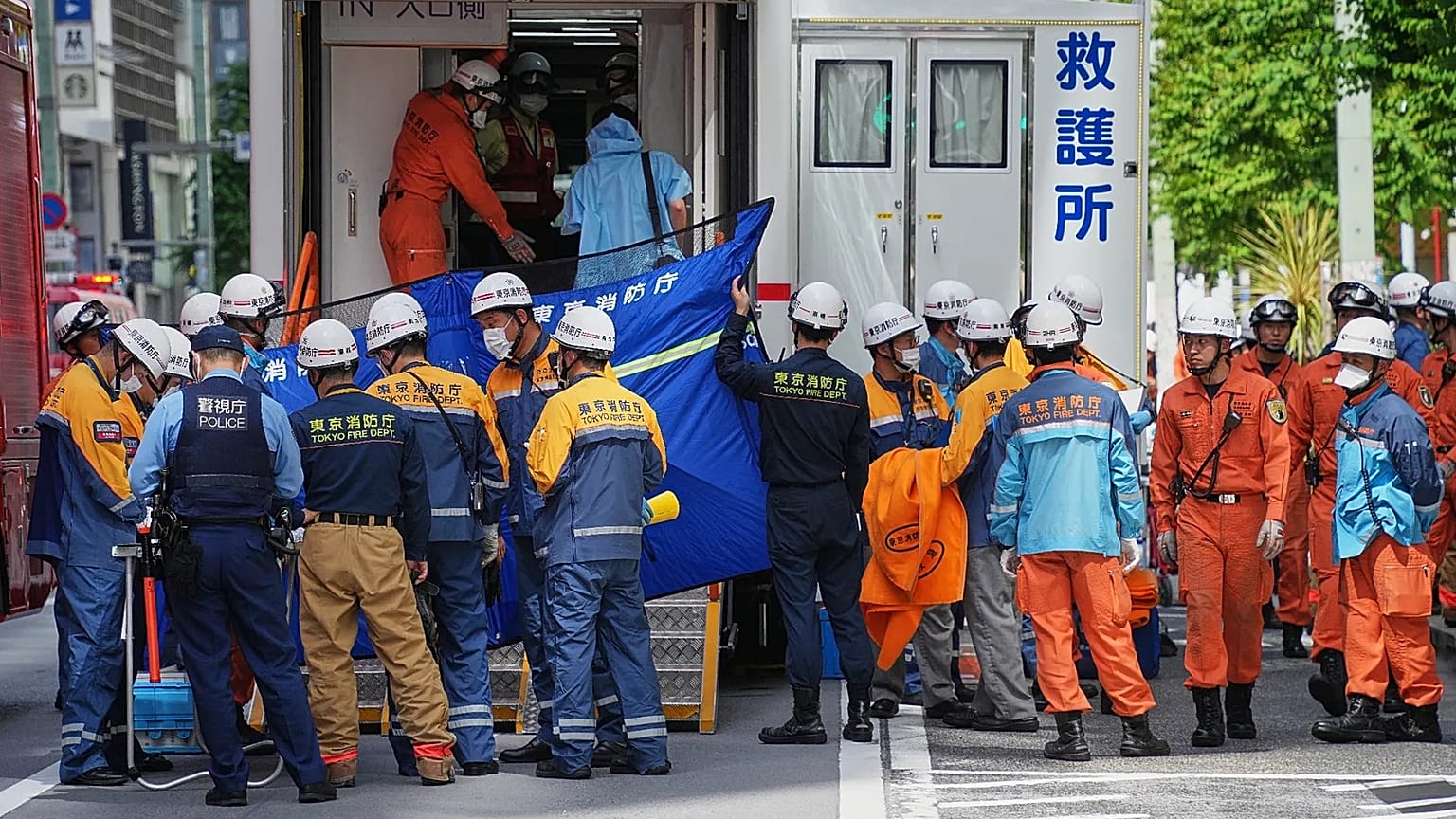 First responders gather near the scene after a person allegedly sprayed a substance that caused an odour in Tokyo, 25 May, 2026