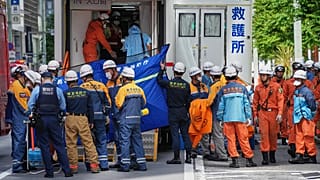 First responders gather near the scene after a person allegedly sprayed a substance that caused an odour in Tokyo, 25 May, 2026