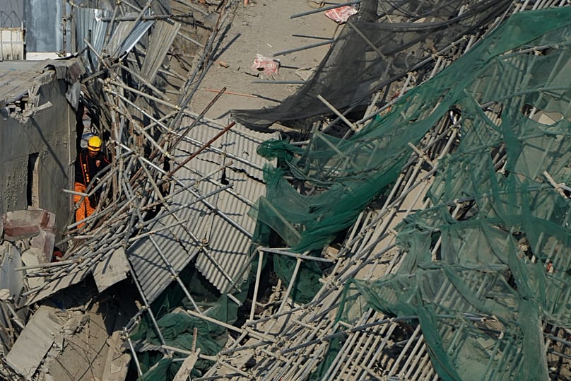 Rescuers continue search operations at a collapsed building where multiple people are believed to be trapped in Angeles city, 25 May, 2026