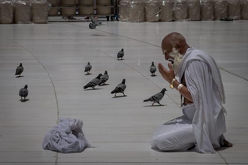 A Muslim pilgrim prays in front of the Kaaba in the holy city of Mecca during the annual hajj pilgrimage, 24 May, 2026
