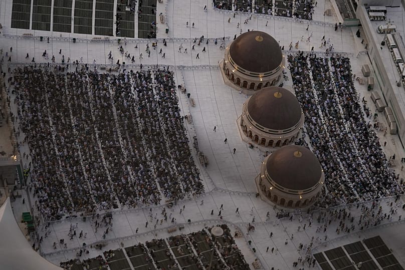 Muslim pilgrims pray on the top floor of the Grand Mosque in the holy city of Mecca during the annual hajj pilgrimage, 24 May, 2026