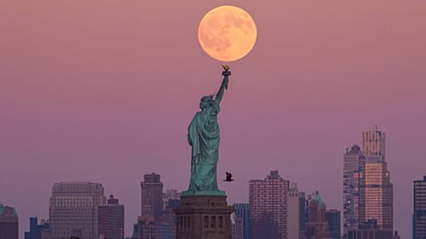 The Statue of Liberty and the Brooklyn skyline in New York City