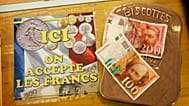 FILE - Bank notes in the former French currency are seen in Collobrieres, southern France, 2 May 2008, at the bakery of Nathalie Lepelletier.