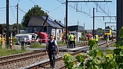 Rescue workers on the scene of a crash between a train and vehicle in Buggenhout, 26 May, 2026
