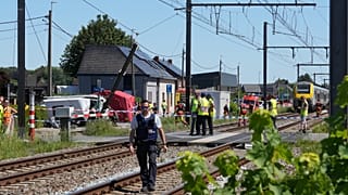 Rescue workers on the scene of a crash between a train and vehicle in Buggenhout, 26 May, 2026