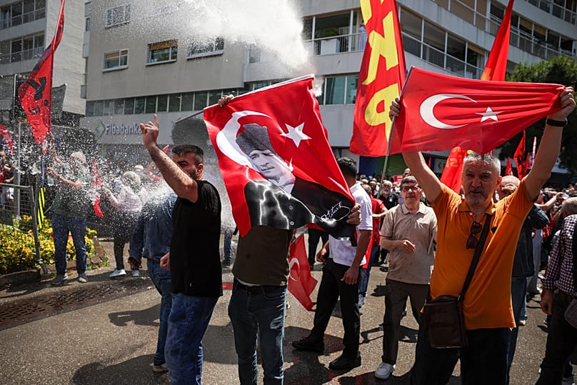 Police use water cannon to disperse supporters of the CHP during a rally in Izmir, 26 May, 2026