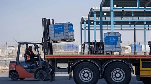 Humanitarian aid waiting to be picked up on the Palestinian side of the Kerem Shalom aid crossing in the Gaza Strip