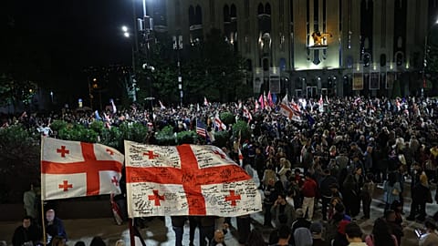 Demonstrators with Georgian national flags attend an opposition rally marking the Independence Day in Tbilisi, Georgia, Tuesday, May 26, 2026. (AP Photo/Zurab Tsertsvadze)