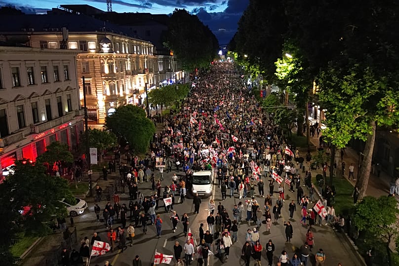 Demonstrators attend an opposition rally marking the Independence Day in Tbilisi, Georgia, Tuesday, May 26, 2026. (AP Photo/Zurab Tsertsvadze)