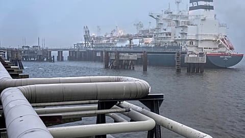 FILE - The 'Hoegh Esperanza' Floating Storage and Regasification Unit (FSRU) is anchored during the opening of the LNG terminal in Wilhelmshaven, Germany. 17 December 2022